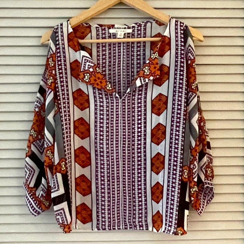 Blouse with cut out sleeves